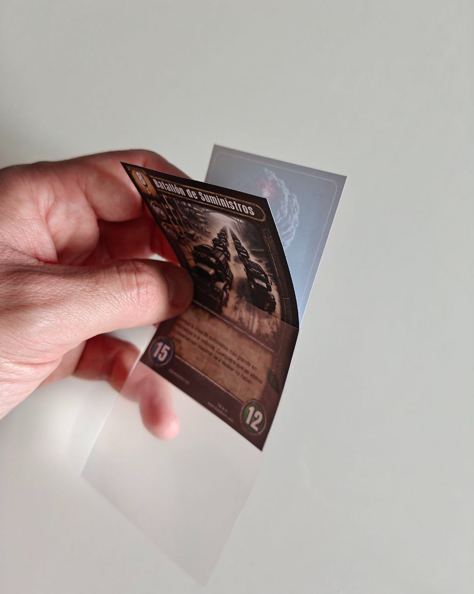 Game card partially pulled out of its sleeve, printed on A4 paper with front and back visible Game card partially pulled out of its sleeve, printed on A4 paper with front and back visible