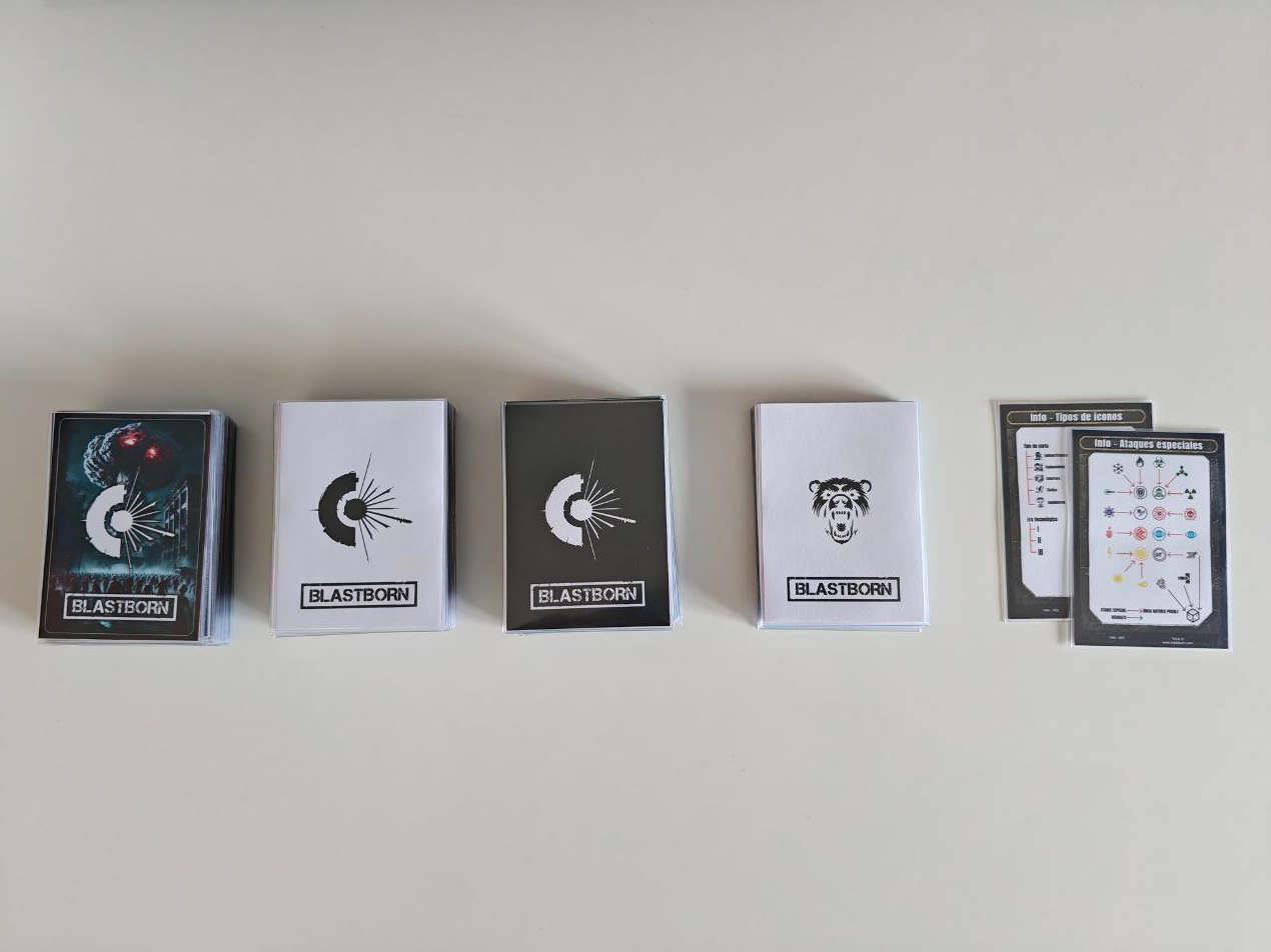 Initial decks of the game printed and placed face down showing the back with the logo Initial decks of the game printed and placed face down showing the back with the logo